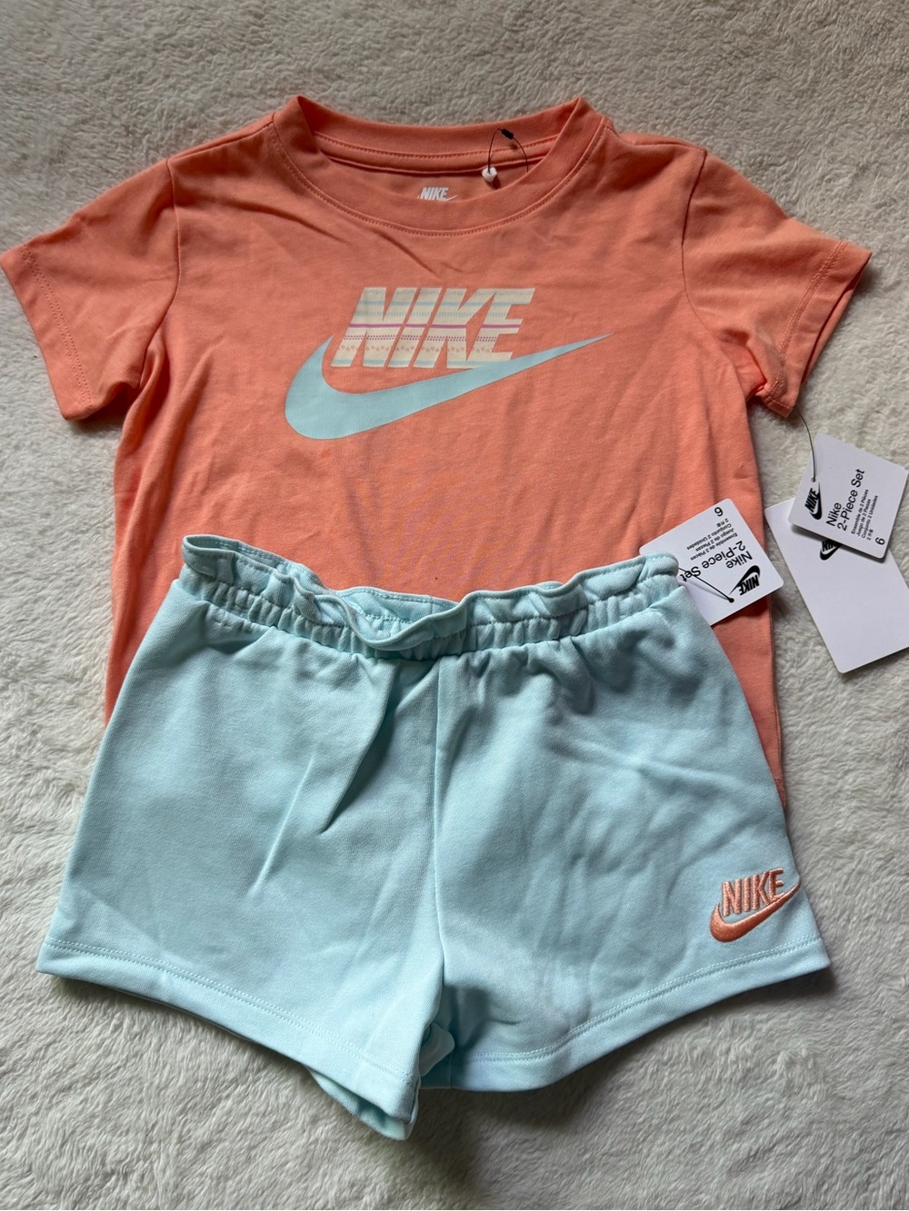 Nike Women's Peach Tee with Light Blue Athletic Shorts